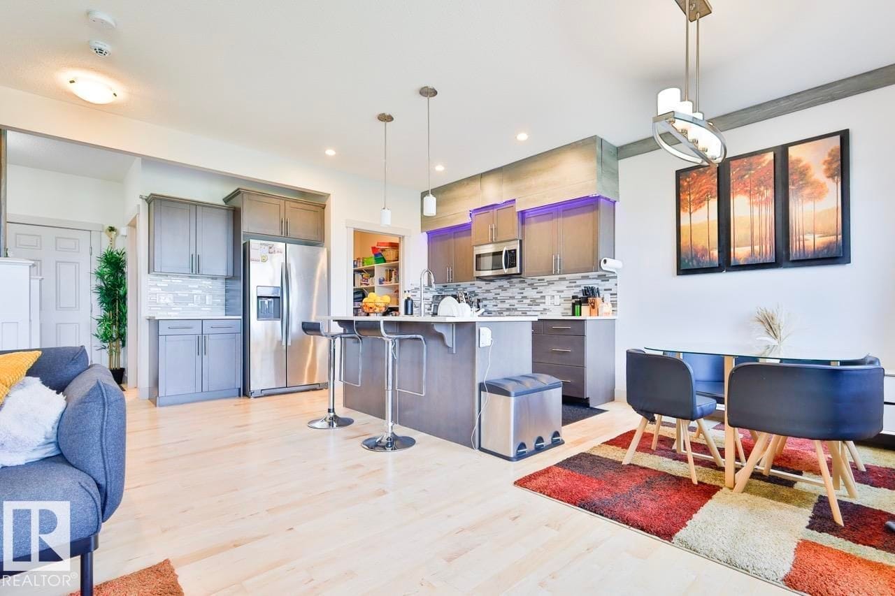Kitchen with island and adjacent dining area