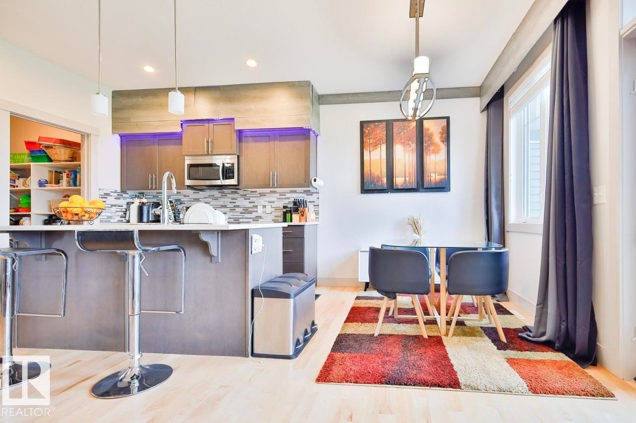 Kitchen island with dining table beyond