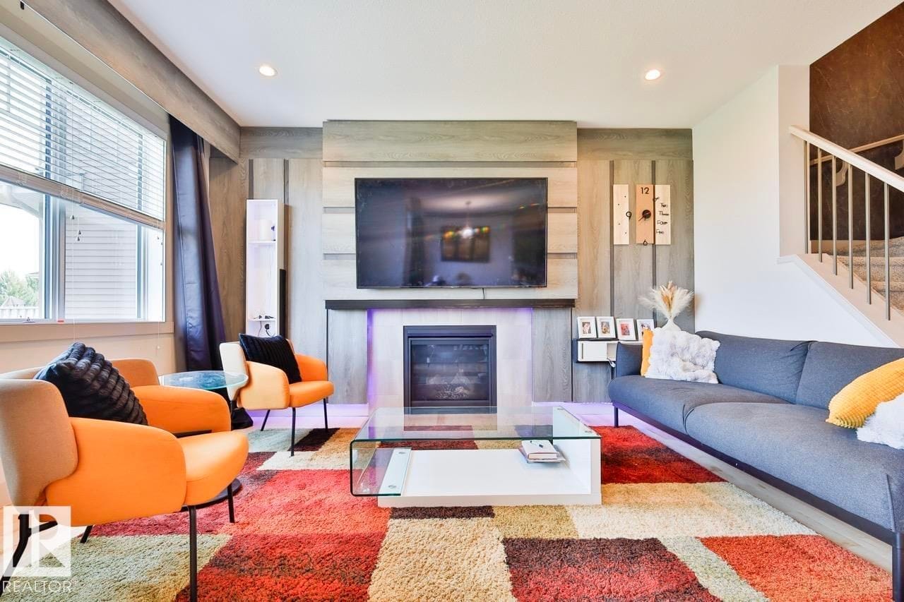 Living room seating area facing the fireplace