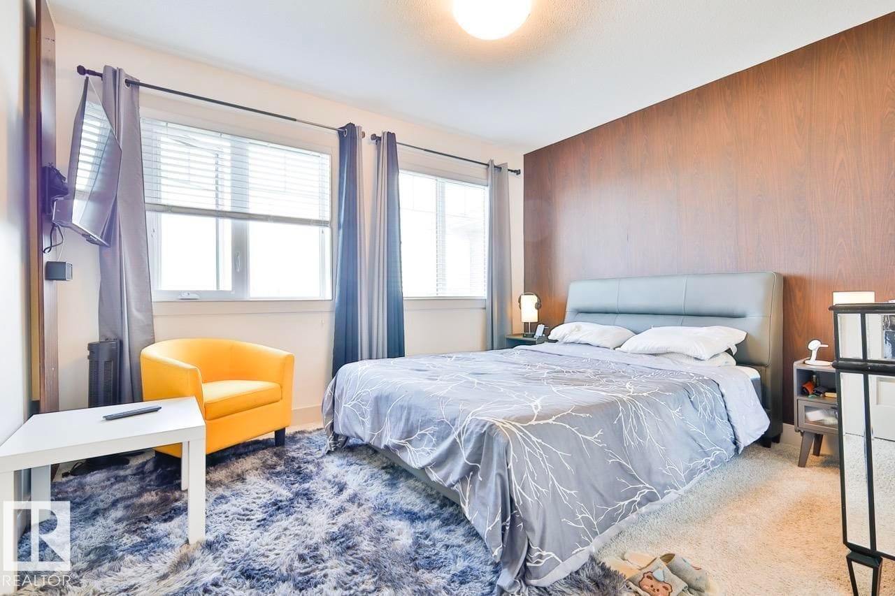 Primary bedroom with feature wall