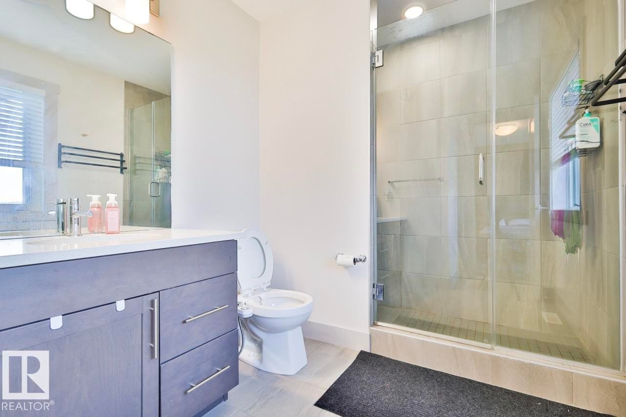 Ensuite with vanity and glass shower