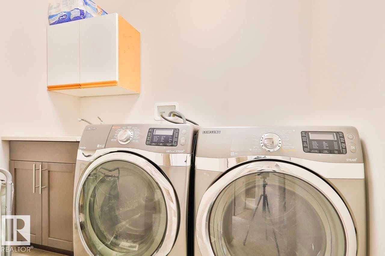Laundry with front load washer and dryer