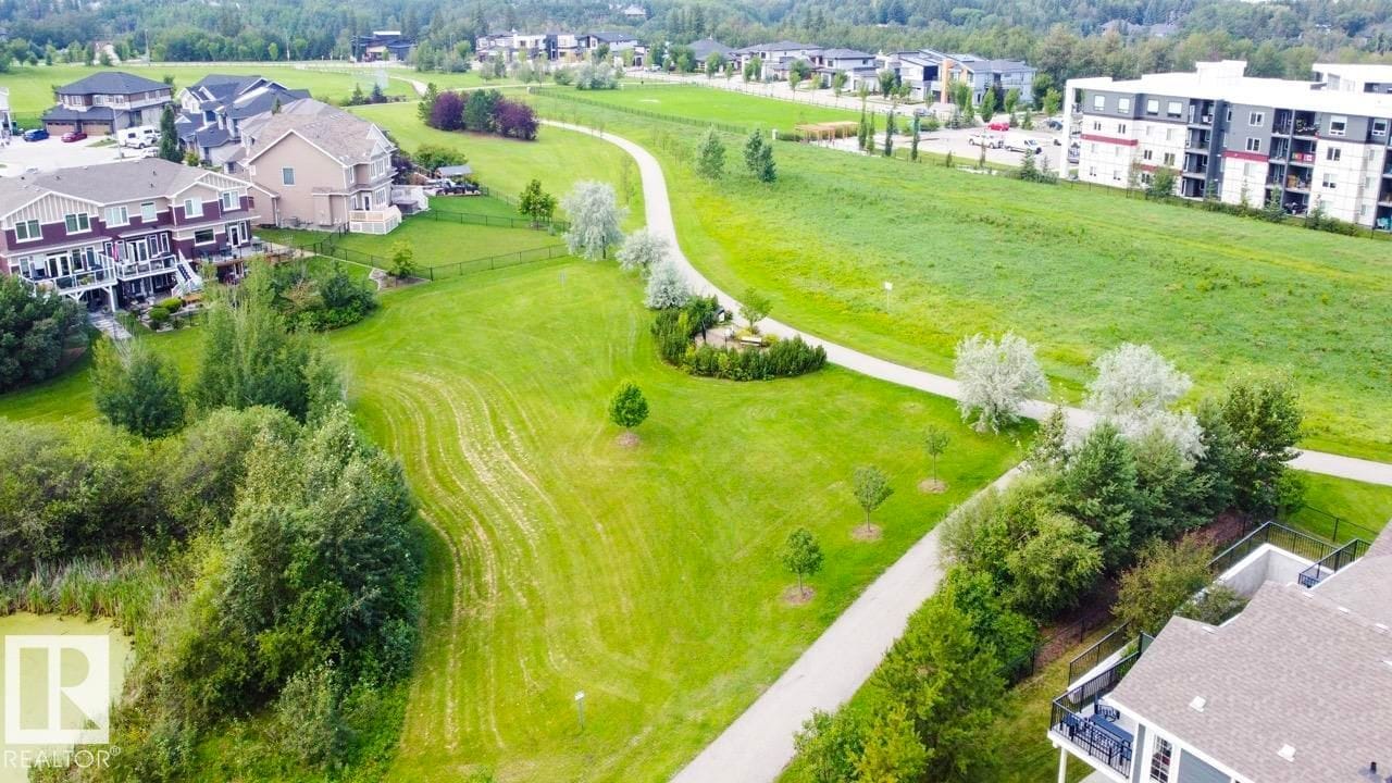 Aerial view of a walking trail through green space