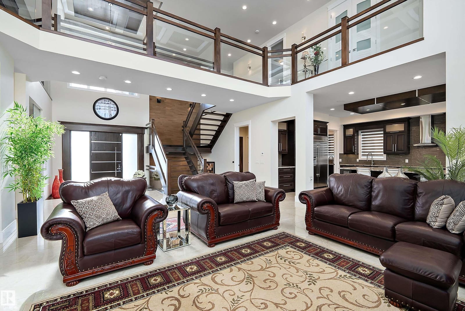 Great room with open to above railing and staircase