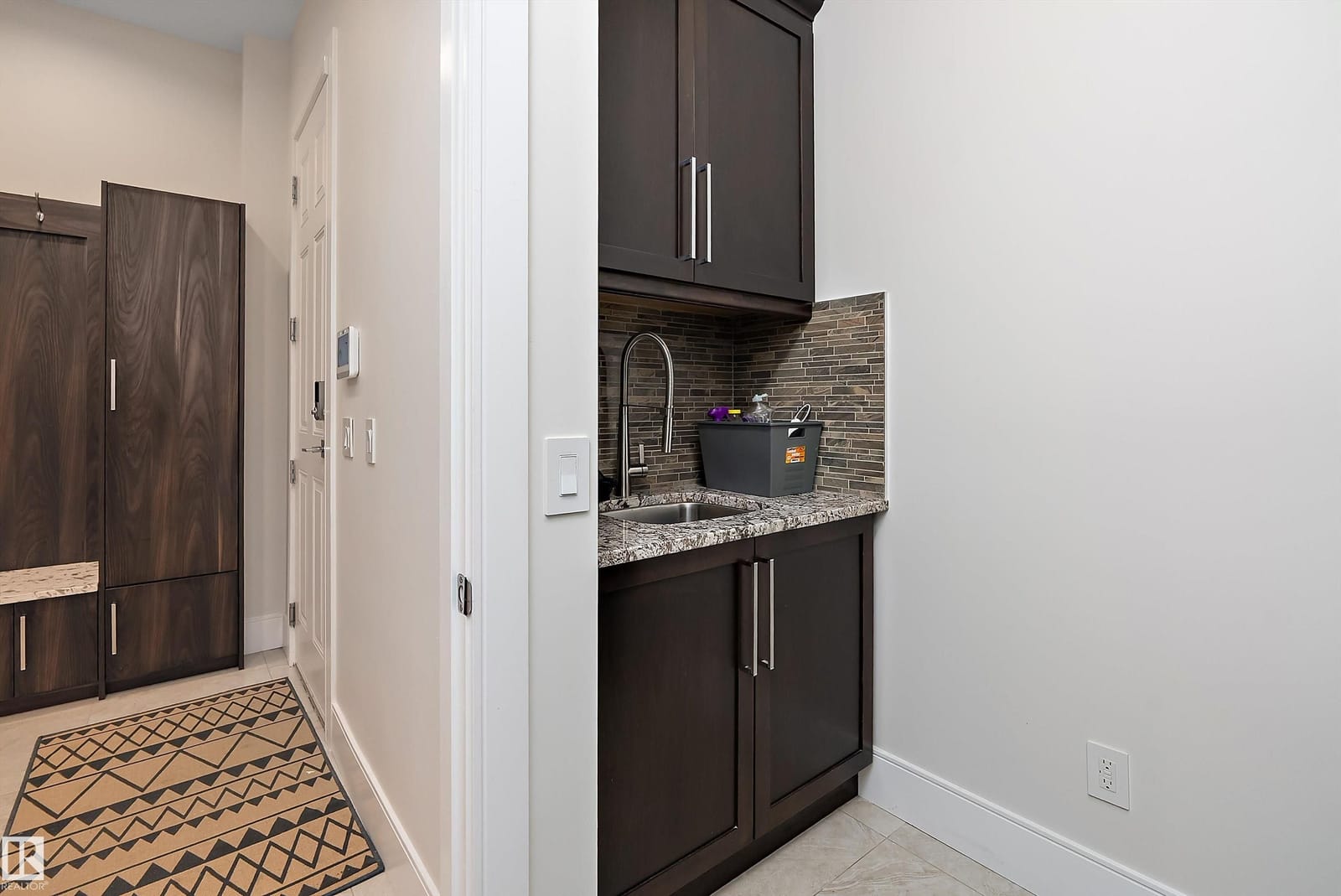 Butler pantry with granite counter