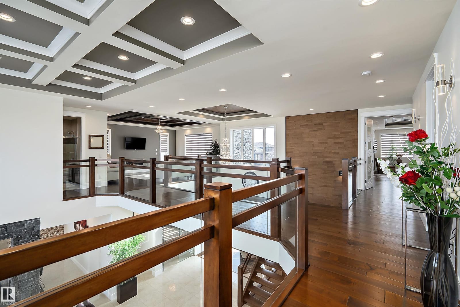 Upper landing with hardwood and glass railing