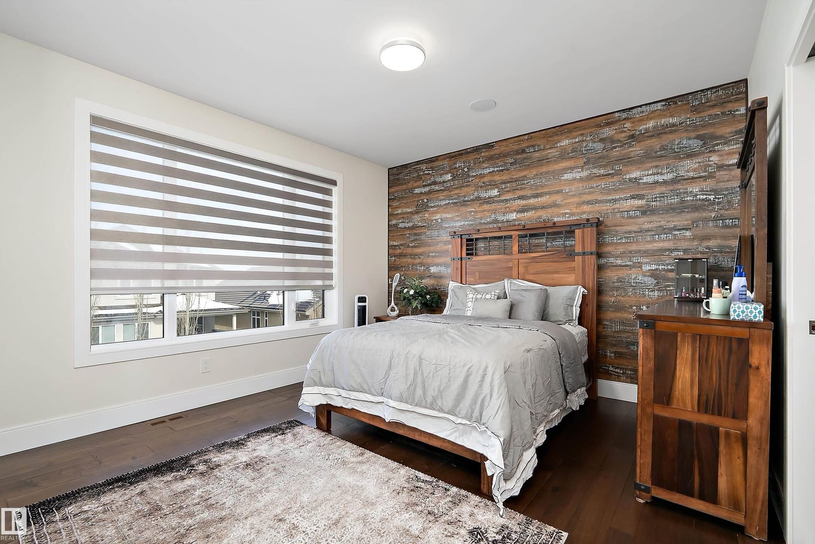 Bedroom with wood accent wall