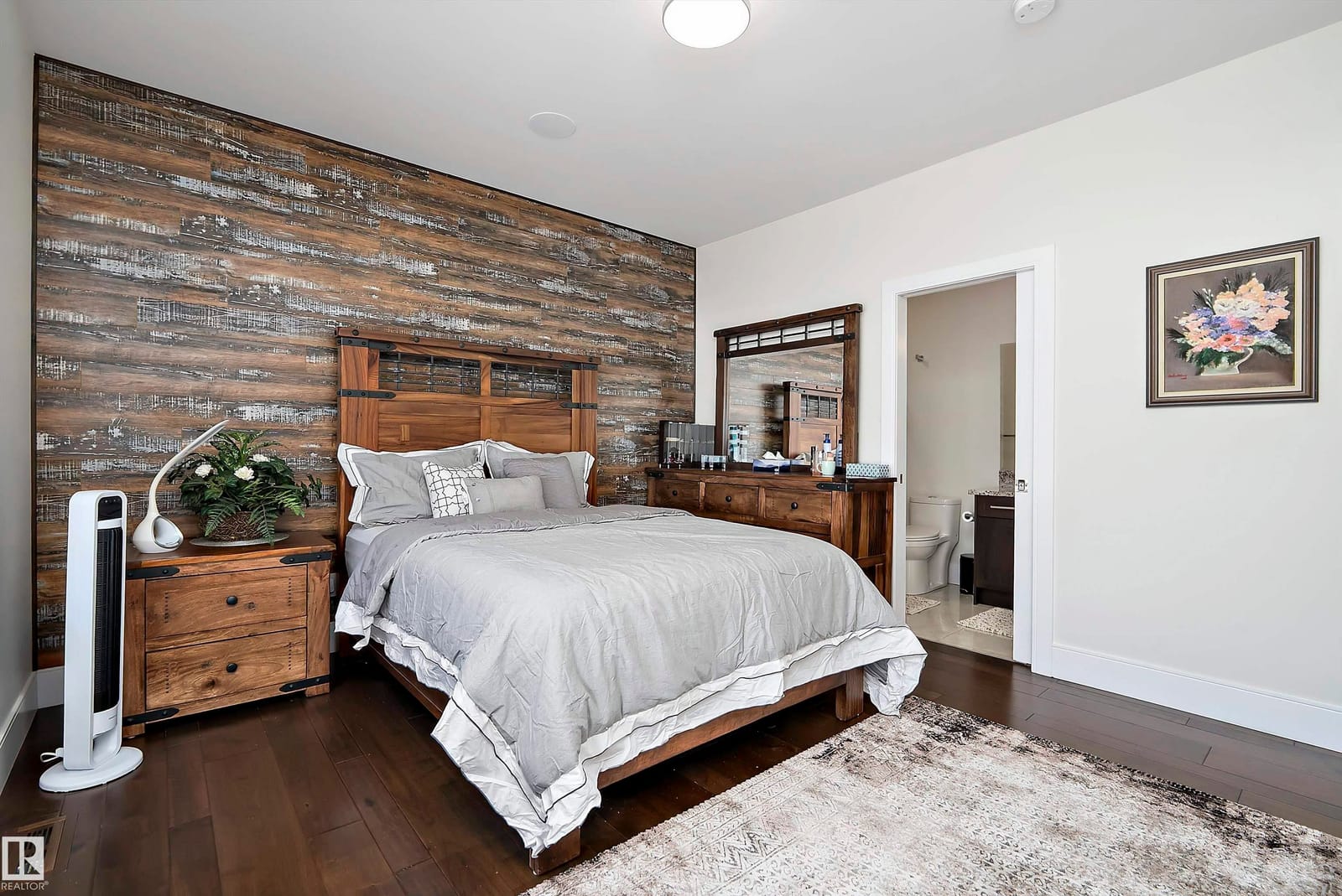 Bedroom with wood accent wall, second angle