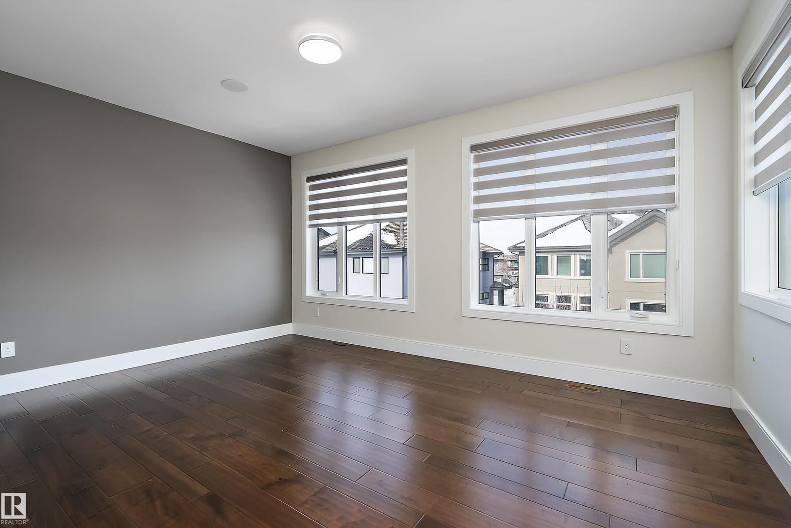 Bedroom with hardwood flooring