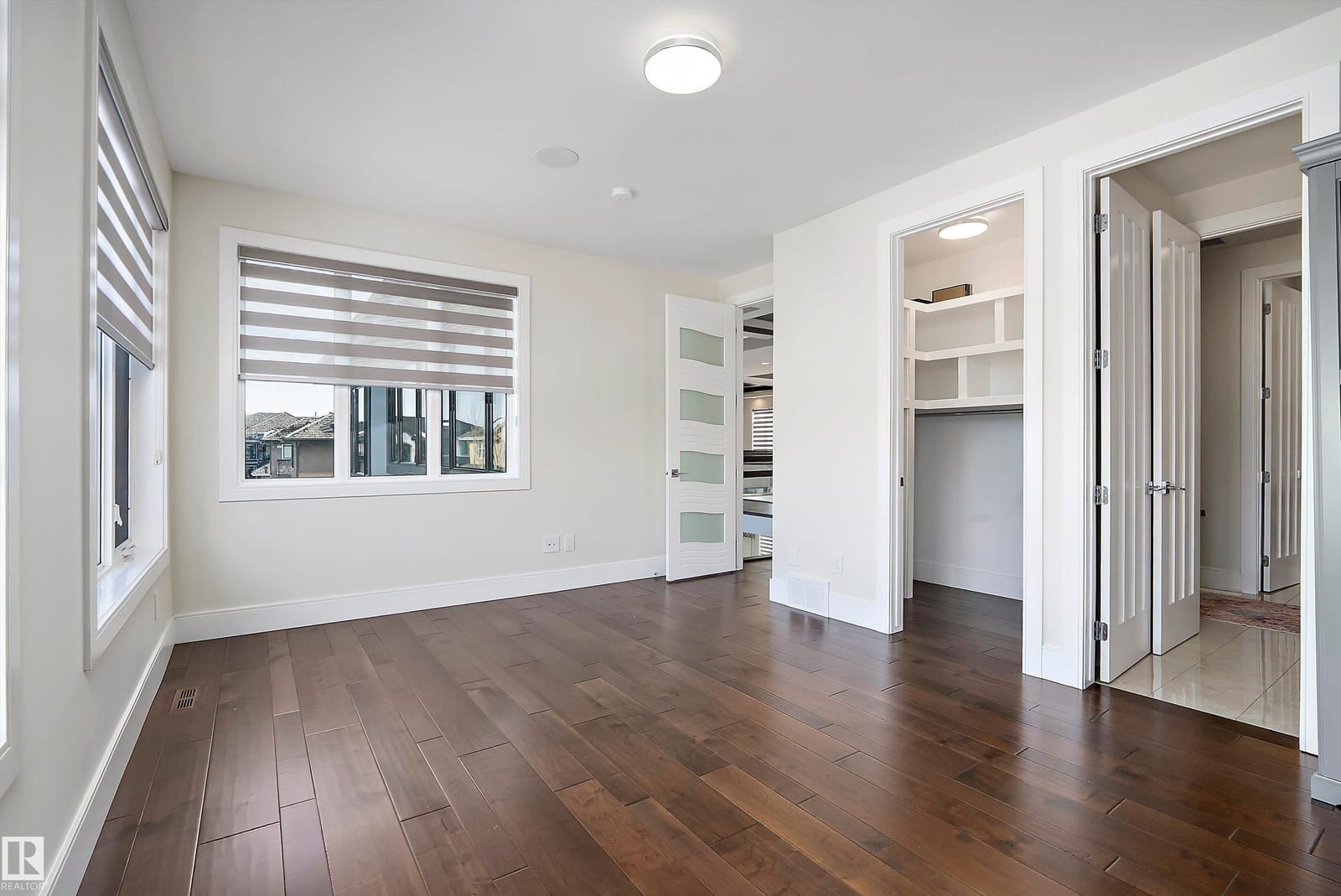 Bedroom with built in shelving