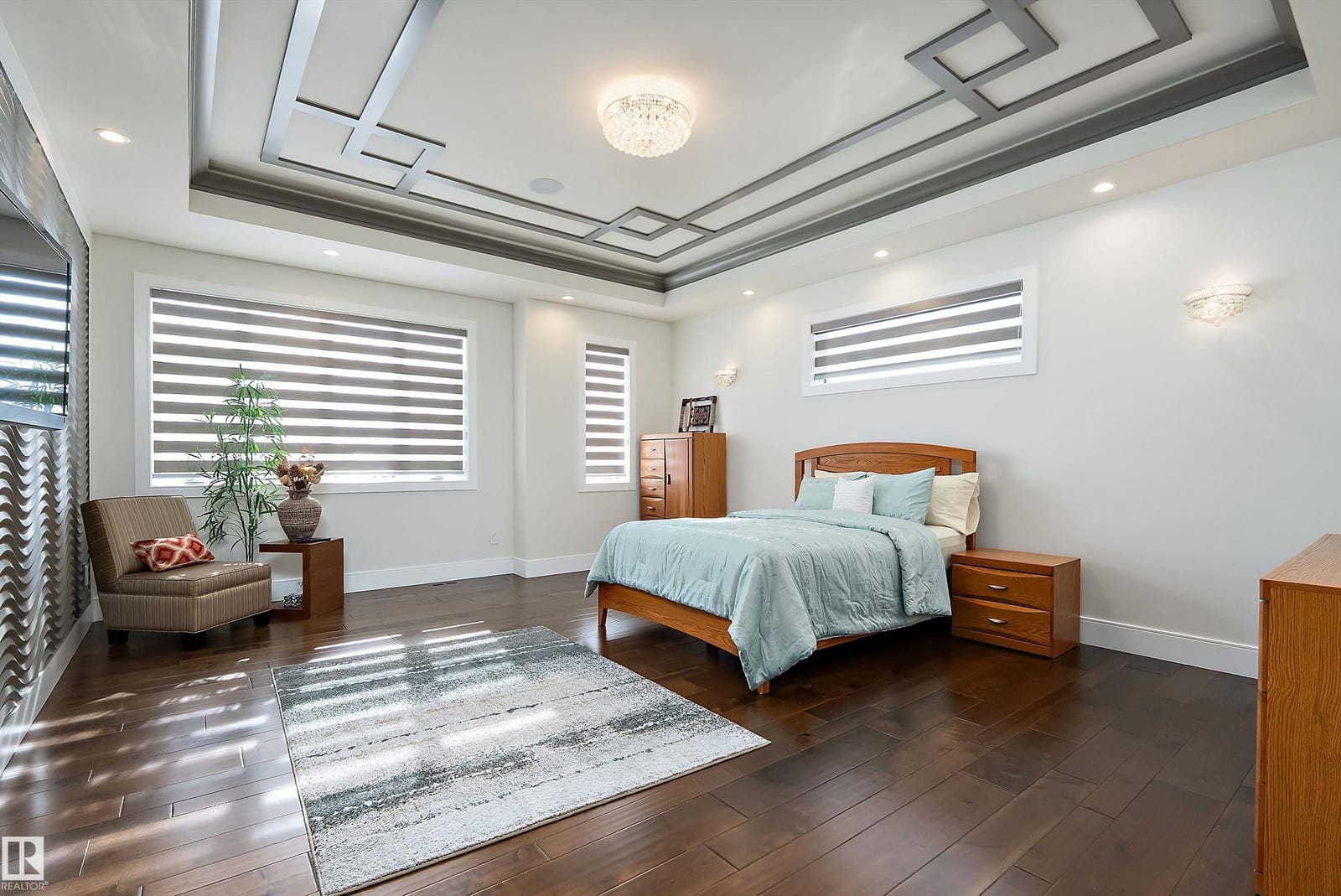 Primary bedroom with coffered ceiling