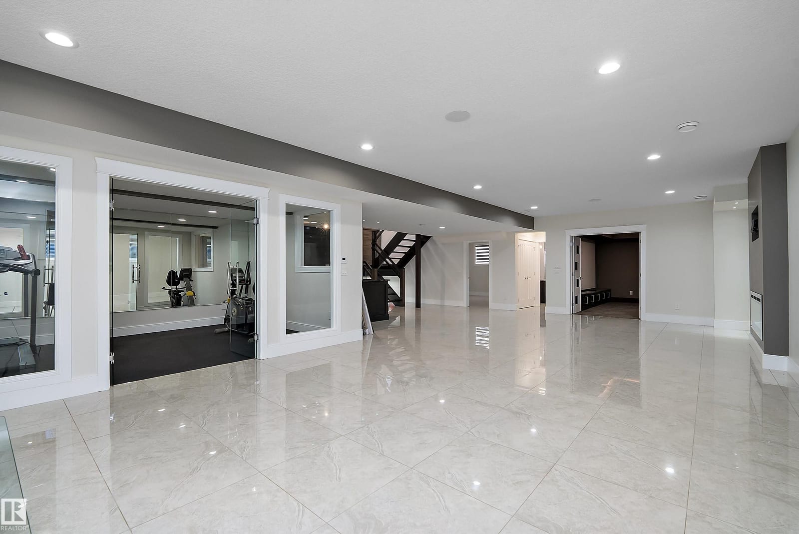 Lower level looking toward the glass walled gym