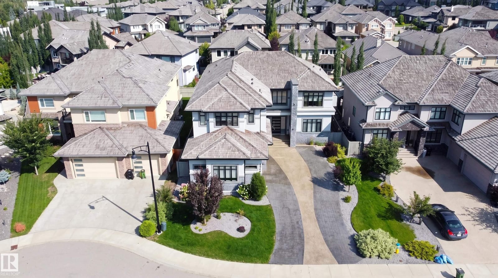 Aerial view of the home and street