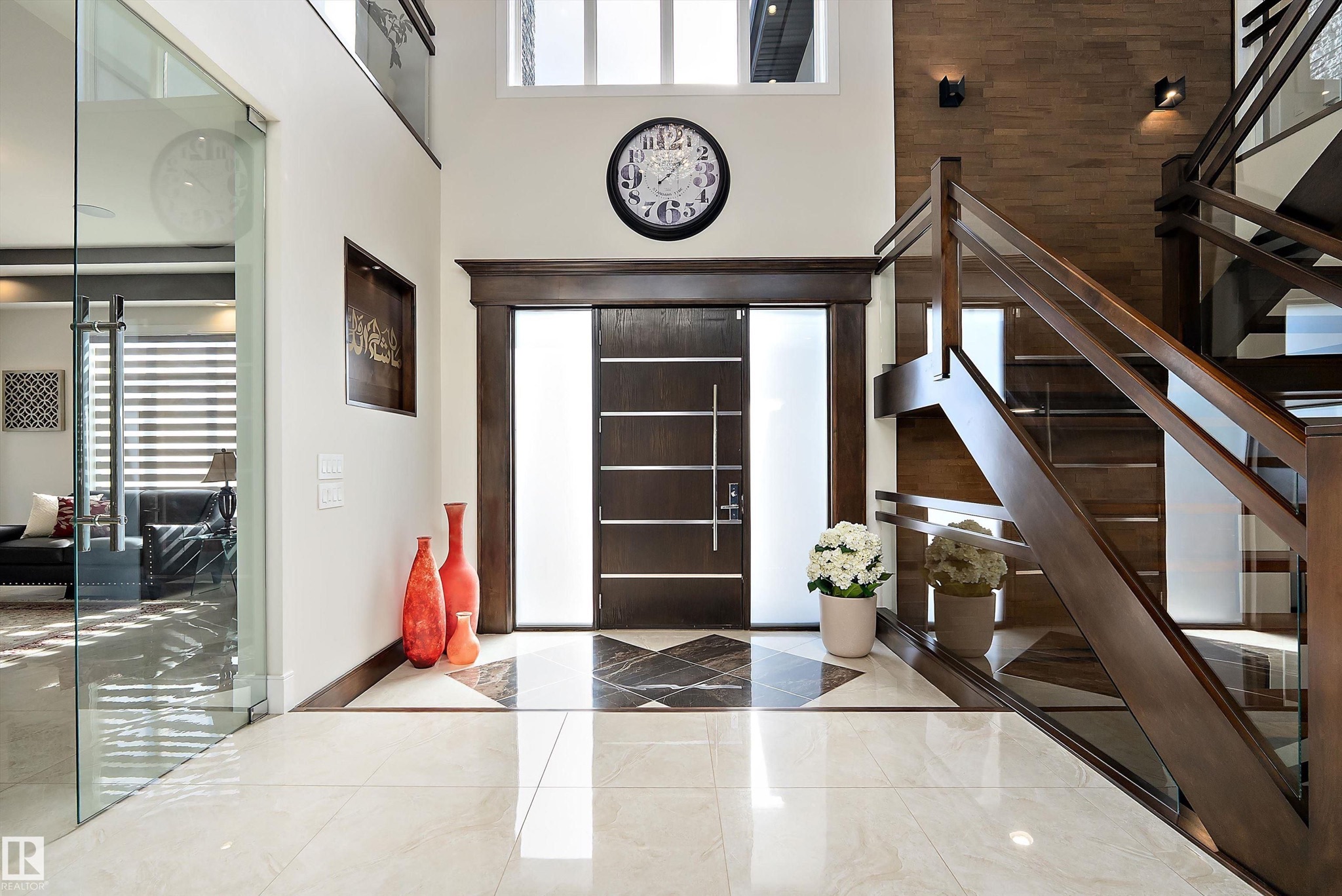Two storey entry foyer with front door and staircase